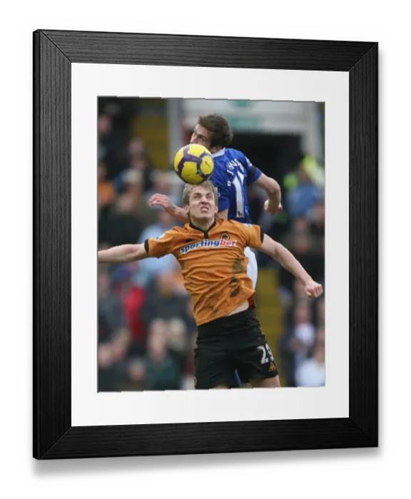 Framed Print : Clash in the Midlands: Premier League Showdown - Kevin Doyle vs. Roger Johnson Framed Print : Clash in the Midlands: Premier League Showdown - Kevin Doyle vs. Roger Johnson