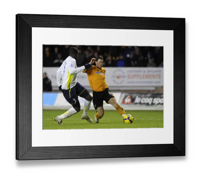 Framed Print : Matt Jarvis vs. Sebastien Bassong: A Premier League Showdown at Wolverhampton Wanderers vs. Tottenham Hotspur