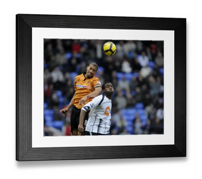 Framed Print : Clash on the Pitch: Henry vs. Muamba - Premier League Showdown: Wolverhampton Wanderers vs. Bolton Wanderers Framed Print : Clash on the Pitch: Henry vs. Muamba - Premier League Showdown: Wolverhampton Wanderers vs. Bolton Wanderers