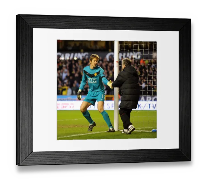 Framed Print : An Unusual Delivery: Edwin van der Sar Receives an Energy Biscuit During Wolverhampton Wanderers vs Manchester United (Barclays Premier League) Framed Print : An Unusual Delivery: Edwin van der Sar Receives an Energy Biscuit During Wolverhampton Wanderers vs Manchester United (Barclays Premier League)