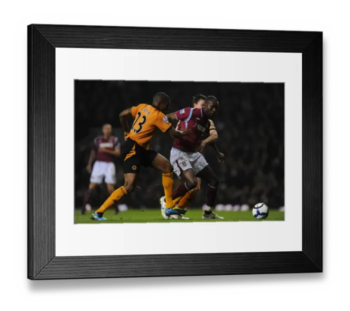 Framed Print : Determined Defenders: Zubar and Foley's Chase Down of Carlton Cole - Wolverhampton Wanderers vs. West Ham United Framed Print : Determined Defenders: Zubar and Foley's Chase Down of Carlton Cole - Wolverhampton Wanderers vs. West Ham United