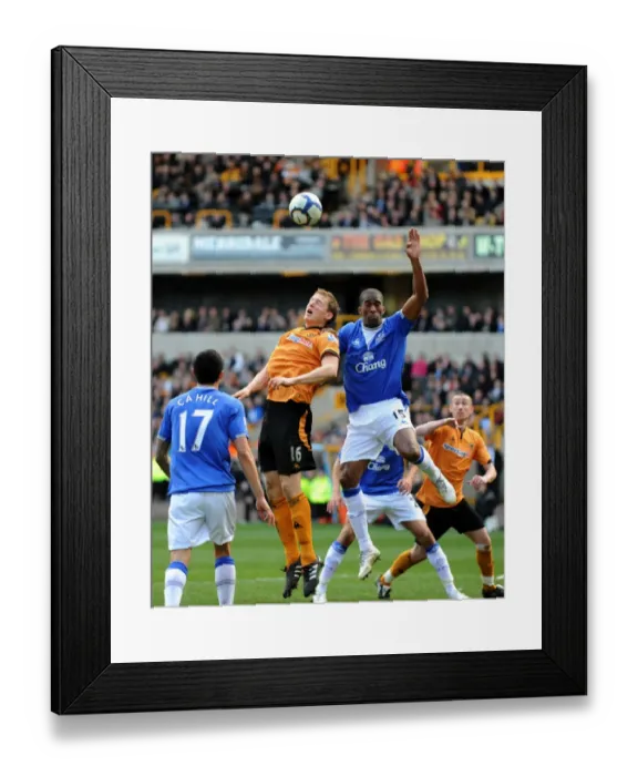 Framed Print : Clash of Titans: Berra vs. Distin - Wolverhampton Wanderers vs. Everton (2010), Barclays Premier League Framed Print : Clash of Titans: Berra vs. Distin - Wolverhampton Wanderers vs. Everton (2010), Barclays Premier League