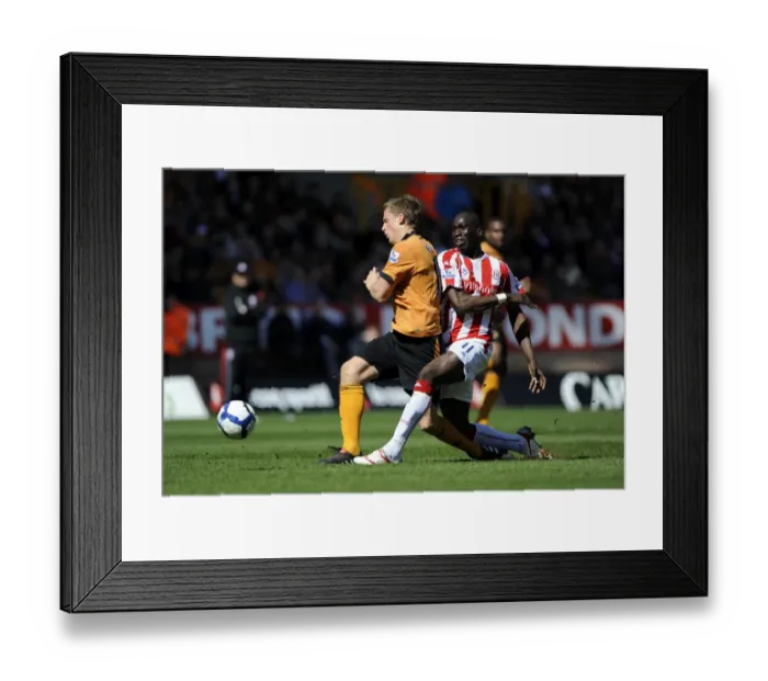 Framed Print : A Tense Clash: Berra vs Sidibe in the Barclays Premier League - Wolverhampton Wanderers vs Stoke City (April 11, 2010)
