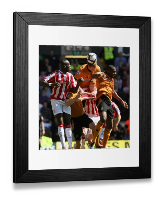 Framed Print : Intense Battle for the Ball: Wolverhampton Wanderers vs Stoke City - Christophe Berra's Headed Clash in Barclays Premier League Framed Print : Intense Battle for the Ball: Wolverhampton Wanderers vs Stoke City - Christophe Berra's Headed Clash in Barclays Premier League