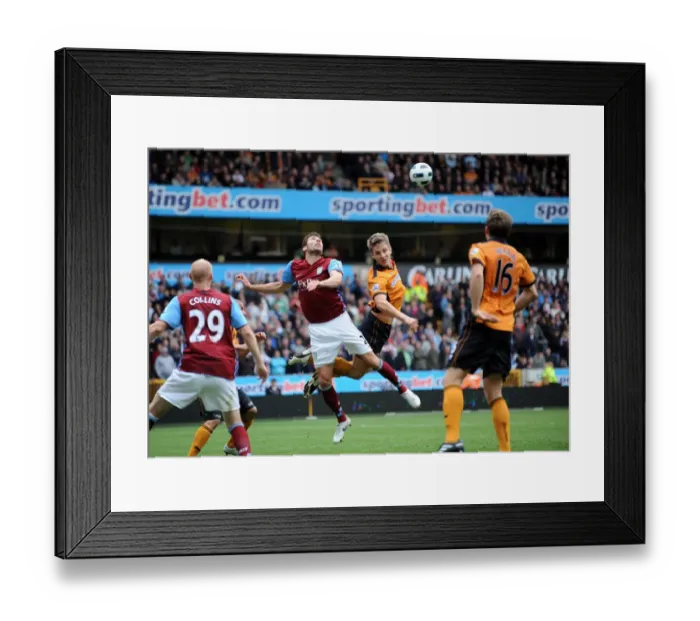 Framed Print : Clash of Titans: Kevin Doyle vs Carlos Cuellar - Wolverhampton Wanderers vs Aston Villa, Barclays Premier League Framed Print : Clash of Titans: Kevin Doyle vs Carlos Cuellar - Wolverhampton Wanderers vs Aston Villa, Barclays Premier League