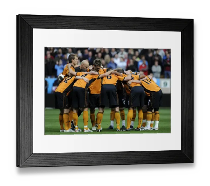 Framed Print : United in Focus: Wolves Players Pre-Match Huddle vs. Aston Villa (Premier League)