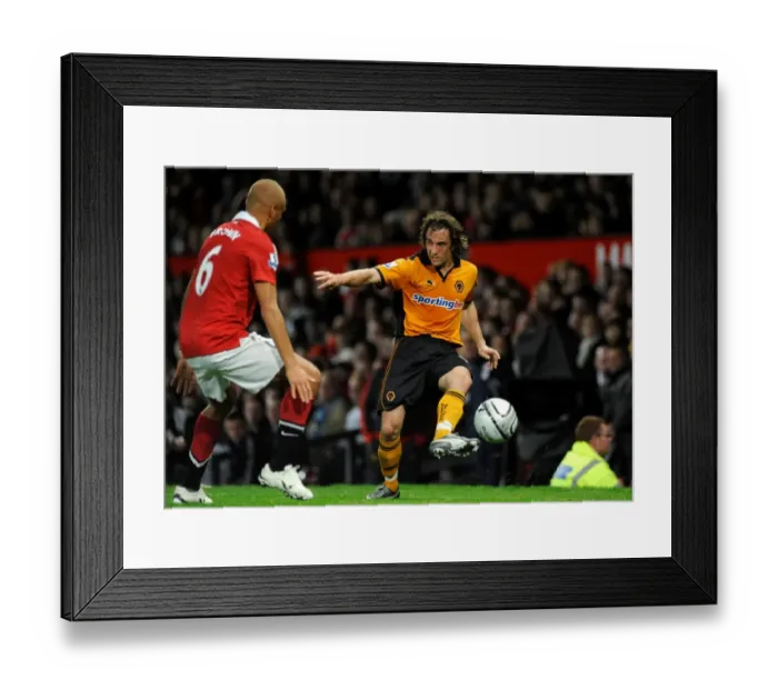 Framed Print : Stephen Hunt vs Wes Brown: A Carling Cup Clash - Manchester United vs Wolverhampton Wanderers: Two Football Giants Go Head to Head Framed Print : Stephen Hunt vs Wes Brown: A Carling Cup Clash - Manchester United vs Wolverhampton Wanderers: Two Football Giants Go Head to Head