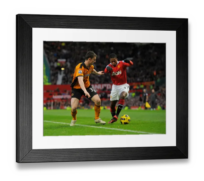 Framed Print : Evra vs. Foley: A Tense Encounter Between Manchester United and Wolverhampton Wanderers in the Premier League Framed Print : Evra vs. Foley: A Tense Encounter Between Manchester United and Wolverhampton Wanderers in the Premier League