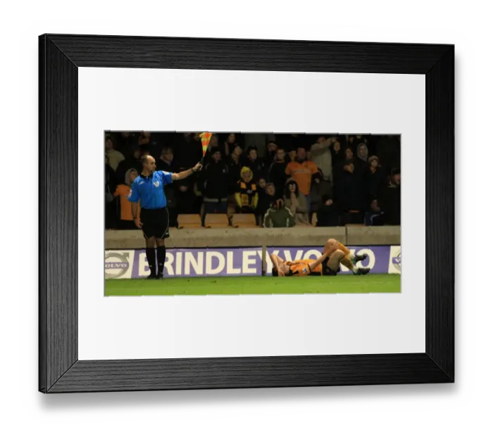 Framed Print : Assistant Referee Signals Foul: Stephen Ward vs. Cesc Fabregas (Wolverhampton Wanderers vs. Arsenal) Framed Print : Assistant Referee Signals Foul: Stephen Ward vs. Cesc Fabregas (Wolverhampton Wanderers vs. Arsenal)