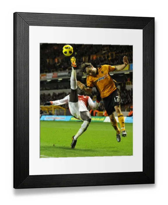 Framed Print : High Stakes Showdown: Wolverhampton Wanderers vs. Arsenal - Aerial Battle: Hunt vs. Sagna Framed Print : High Stakes Showdown: Wolverhampton Wanderers vs. Arsenal - Aerial Battle: Hunt vs. Sagna