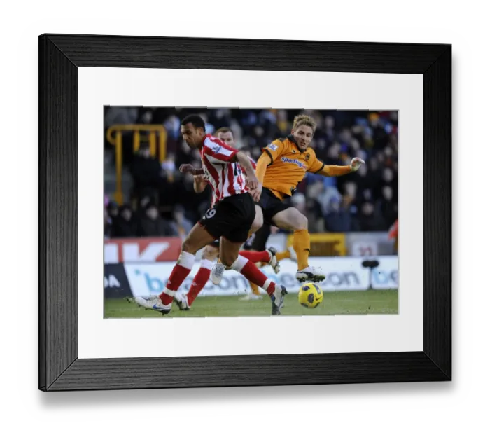 Framed Print : Clash between Kevin Doyle and Anton Ferdinand: A Intense Moment in the Wolverhampton Wanderers vs Sunderland Barclays Premier League Match
