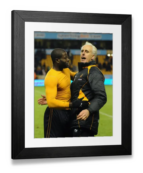 Framed Print : Wolverhampton Wanderers: Mick McCarthy and George Elokobi's Emotional Reunion After Premier League Victory Framed Print : Wolverhampton Wanderers: Mick McCarthy and George Elokobi's Emotional Reunion After Premier League Victory
