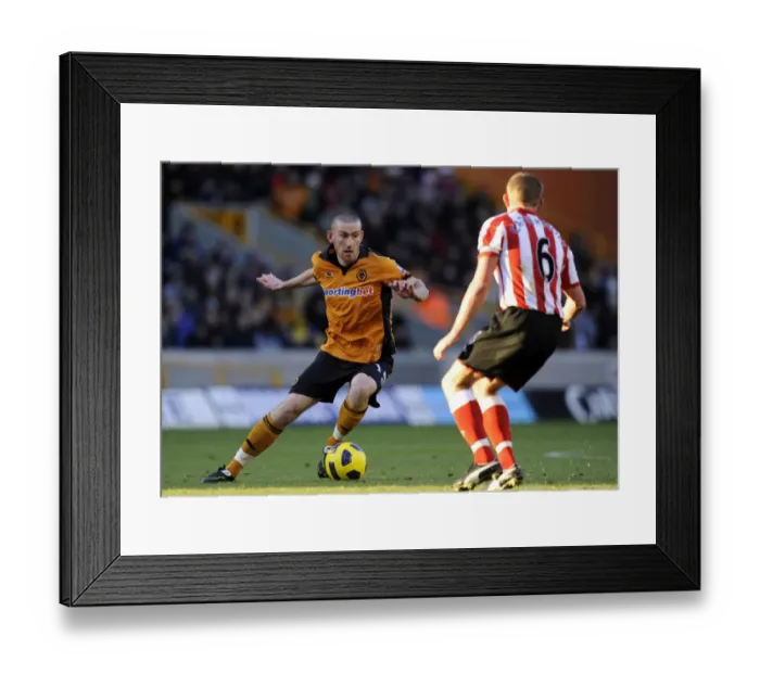 Framed Print : David Jones vs Lee Cattermole: Intense Rivalry in Wolverhampton Wanderers vs Sunderland Barclays Premier League Clash