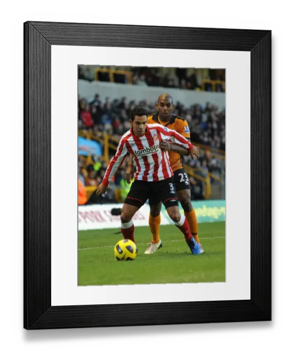 Framed Print : Wolverhampton Wanderers vs Sunderland: A Fierce Clash between Kieran Richardson and Ronald Zubar in the Premier League