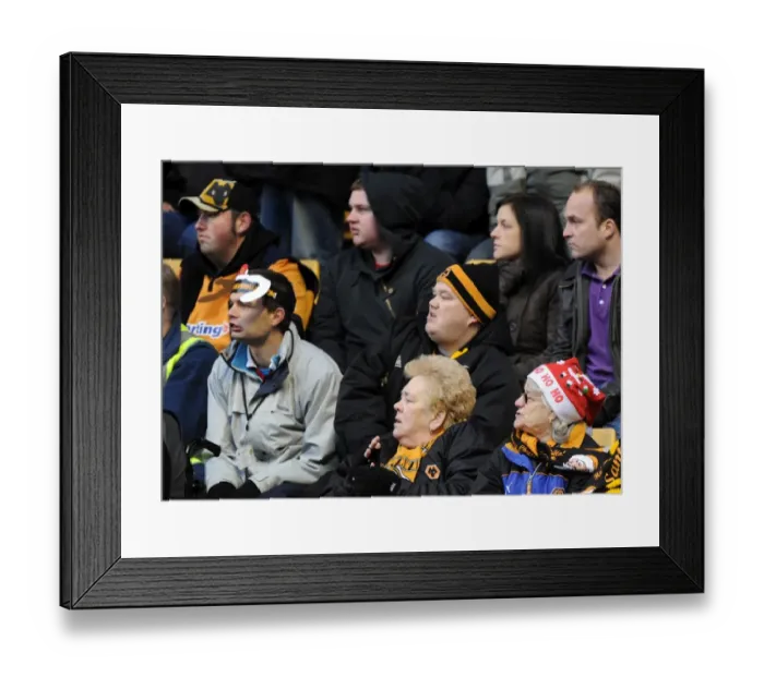 Framed Print : A Festive Showdown: Wolverhampton Wanderers vs Birmingham City - Woman in Santa Hat Framed Print : A Festive Showdown: Wolverhampton Wanderers vs Birmingham City - Woman in Santa Hat