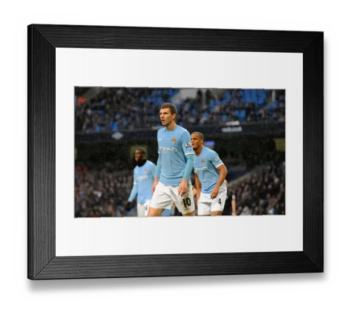 Framed Print : Clash of Titans: Edin Dzeko's Determined Battle – Manchester City vs. Wolverhampton Wanderers