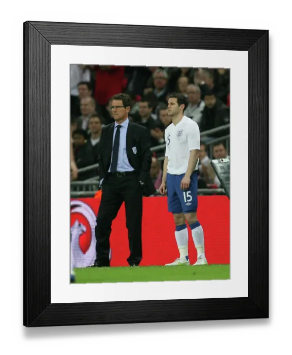 Framed Print : Fabio Capello Ponders Substitution: Matthew Jarvis of Wolverhampton Wanderers Ready to Enter the Field for England