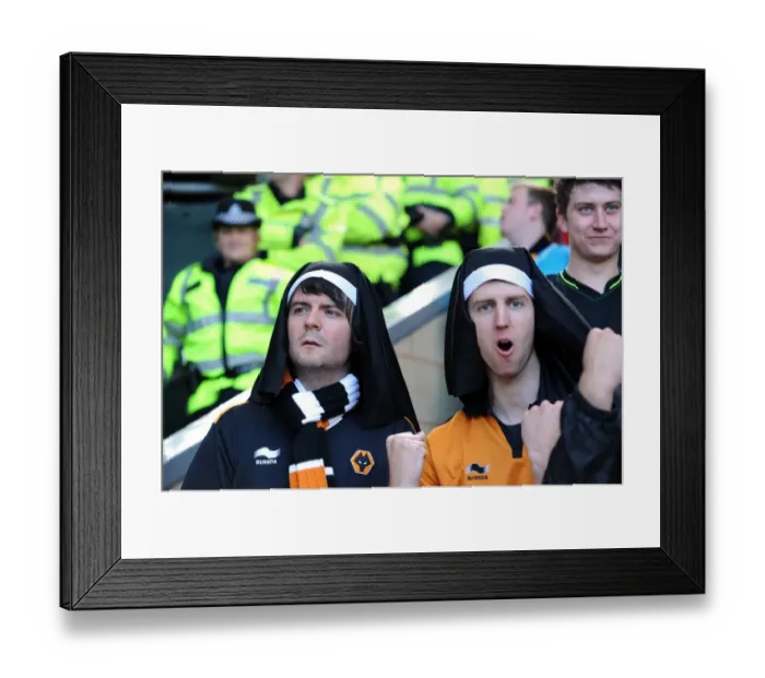 Framed Print : Wolverhampton Wanderers vs. West Bromwich Albion: A Premier League Rivalry - Passionate Wolves Fans Ignite the Stadium Framed Print : Wolverhampton Wanderers vs. West Bromwich Albion: A Premier League Rivalry - Passionate Wolves Fans Ignite the Stadium