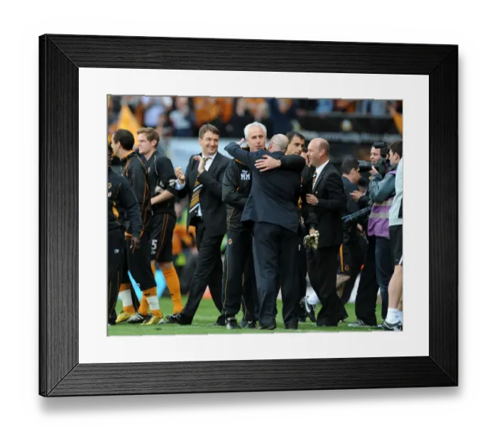 Framed Print : United in Sportsmanship: Mick McCarthy and Steve Kean's Heartwarming Embrace after Wolves vs. Blackburn Rovers, Premier League Framed Print : United in Sportsmanship: Mick McCarthy and Steve Kean's Heartwarming Embrace after Wolves vs. Blackburn Rovers, Premier League