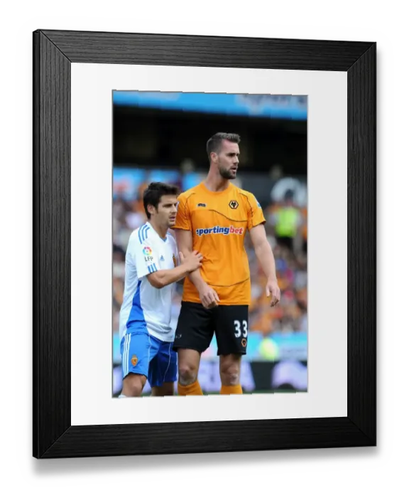 Framed Print : Little and Large: A Clash of Titans - Maierhoffer vs. Paredes Arango in Wolverhampton Wanderers vs. Real Zaragoza Pre-season Friendly Framed Print : Little and Large: A Clash of Titans - Maierhoffer vs. Paredes Arango in Wolverhampton Wanderers vs. Real Zaragoza Pre-season Friendly