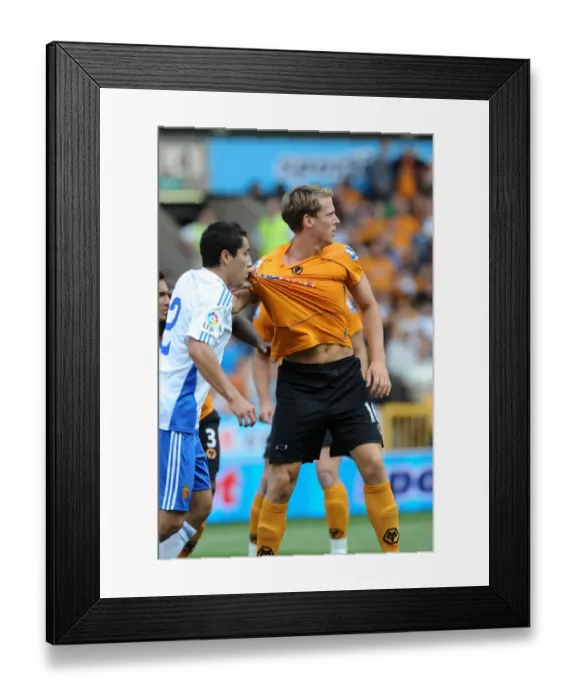 Framed Print : Intense Pre-Season Clash: Berra vs. Juarez - Wolves vs. Real Zaragoza: A Battle for Supremacy