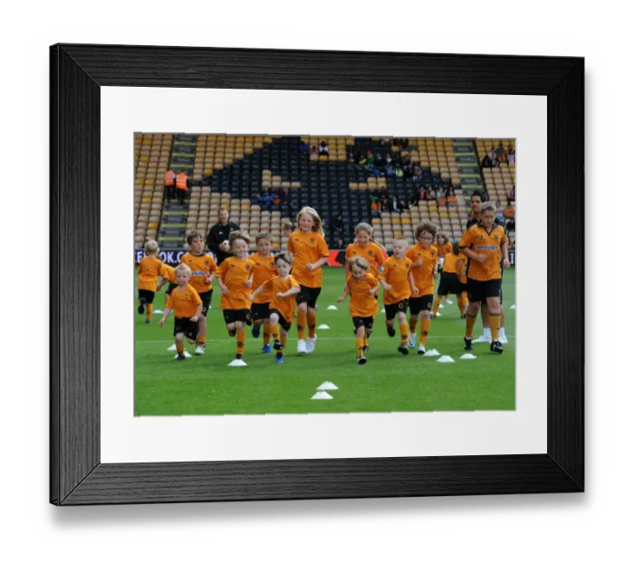 Framed Print : Wolverhampton Wanderers: Matchday Mascots Gear Up for Wolves vs. Real Zaragoza Showdown - Behind the Scenes Training Framed Print : Wolverhampton Wanderers: Matchday Mascots Gear Up for Wolves vs. Real Zaragoza Showdown - Behind the Scenes Training