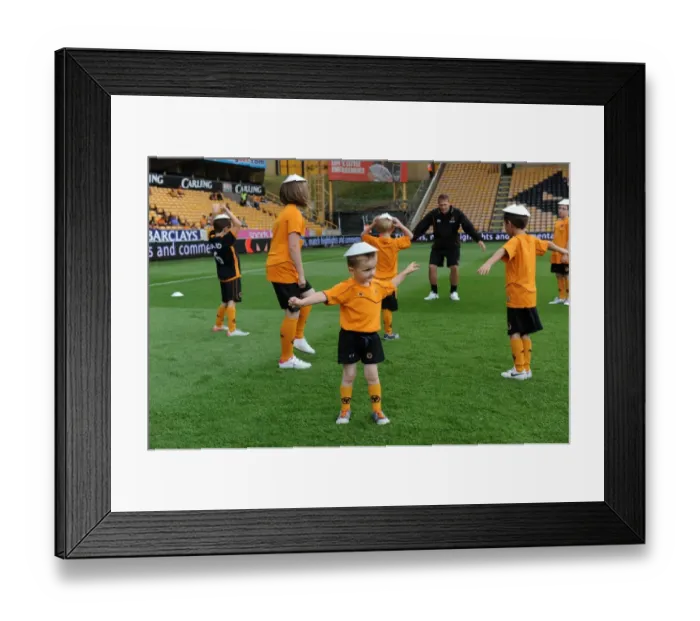 Framed Print : Wolverhampton Wanderers: Matchday Mascots Pre-Game Training - Wolves vs. Real Zaragoza Framed Print : Wolverhampton Wanderers: Matchday Mascots Pre-Game Training - Wolves vs. Real Zaragoza