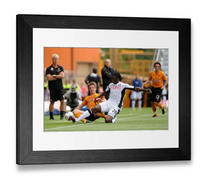 Framed Print : Clash of the Titans: Kevin Doyle vs Dickson Etuhu in Wolverhampton Wanderers vs Fulham Premier League Showdown Framed Print : Clash of the Titans: Kevin Doyle vs Dickson Etuhu in Wolverhampton Wanderers vs Fulham Premier League Showdown