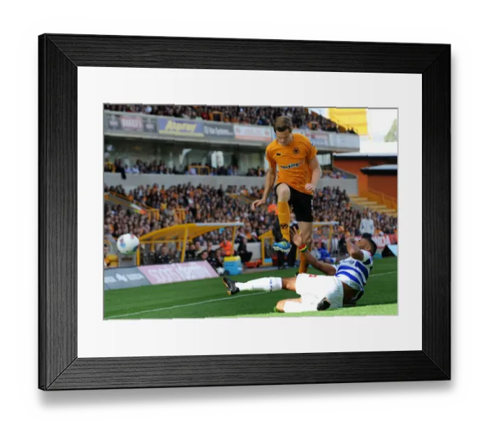 Framed Print : Leaping Over the Challenge: Stearman's Aerial Victory in Wolves vs. QPR (Premier League Soccer)