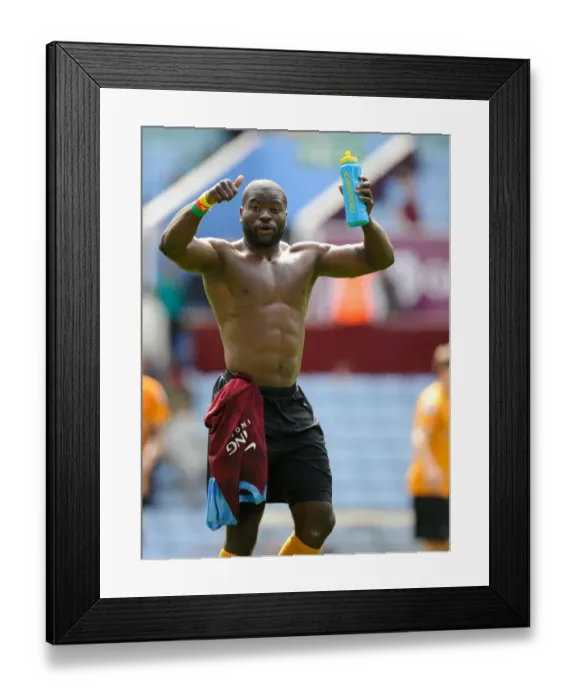 Framed Print : George Elokobi's Dramatic Final Moments: Aston Villa vs. Wolverhampton Wanderers in the Barclays Premier League - The Thrilling Conclusion