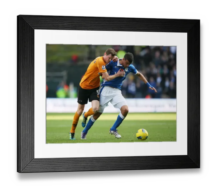 Framed Print : Stearman vs Di Santo: A Premier League Showdown at Wolverhampton Wanderers - Intense Battle Between Richard Stearman and Franco Di Santo