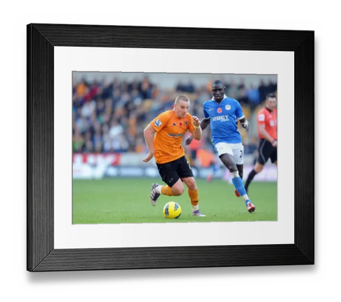 Framed Print : Wolverhampton Wanderers vs Wigan Athletic: A Clash of Football Titans - Jamie O'Hara vs Mohamed Diame: Battle of Midfield Giants Framed Print : Wolverhampton Wanderers vs Wigan Athletic: A Clash of Football Titans - Jamie O'Hara vs Mohamed Diame: Battle of Midfield Giants