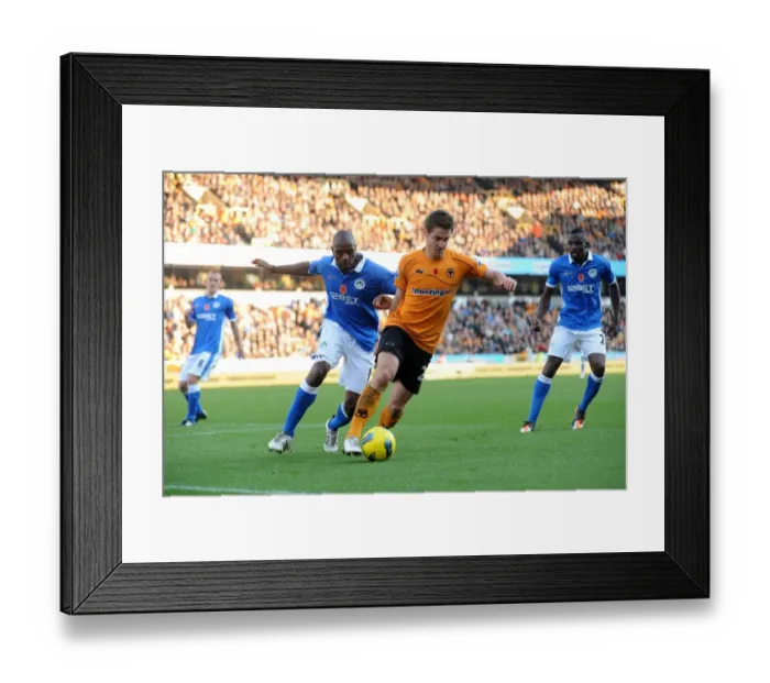Framed Print : Clash between Kevin Doyle and Emmerson Boyce: A Battle in the Wolverhampton Wanderers vs Wigan Athletic Barclays Premier League Match Framed Print : Clash between Kevin Doyle and Emmerson Boyce: A Battle in the Wolverhampton Wanderers vs Wigan Athletic Barclays Premier League Match