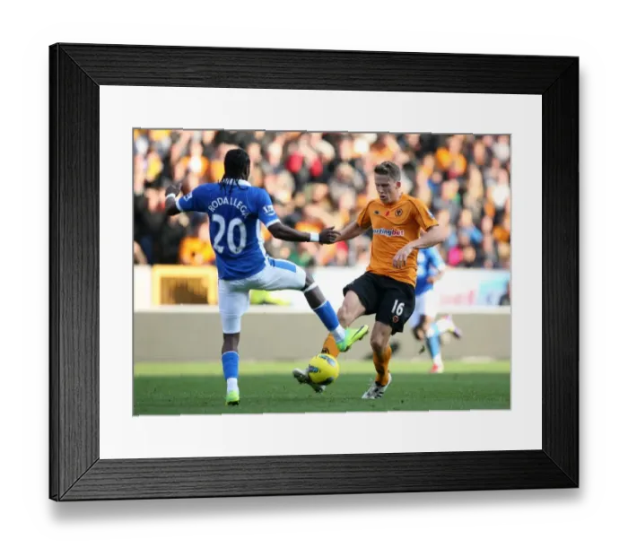 Framed Print : Determination on the Pitch: Berra vs. Rodallega - Wolverhampton Wanderers vs. Wigan Athletic