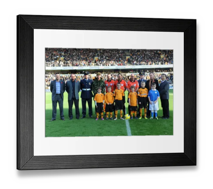 Framed Print : Wolverhampton Wanderers vs Wigan Athletic: A Premier League Mascot Showdown - The Clash of the Wolves and Latics