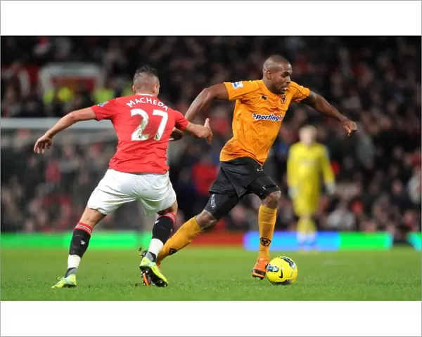 A Tactical Battle: Ronald Zubar of Wolverhampton Wanderers Focused Against Manchester United in Premier League Action