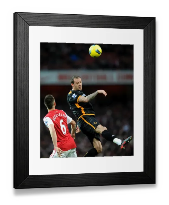 Framed Print : Clash of Titans: Steven Fletcher vs. Laurent Koscielny - Premier League Showdown Framed Print : Clash of Titans: Steven Fletcher vs. Laurent Koscielny - Premier League Showdown