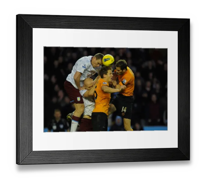Framed Print : Intense Rivalry: Dunne vs. Collins & Berra - Wolverhampton Wanderers vs. Aston Villa, Premier League Battle Framed Print : Intense Rivalry: Dunne vs. Collins & Berra - Wolverhampton Wanderers vs. Aston Villa, Premier League Battle