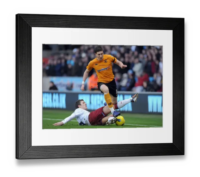 Framed Print : Wolverhampton Wanderers vs Aston Villa: Intense Encounter between Stephen Ward and Gary Gardner in the Premier League Framed Print : Wolverhampton Wanderers vs Aston Villa: Intense Encounter between Stephen Ward and Gary Gardner in the Premier League