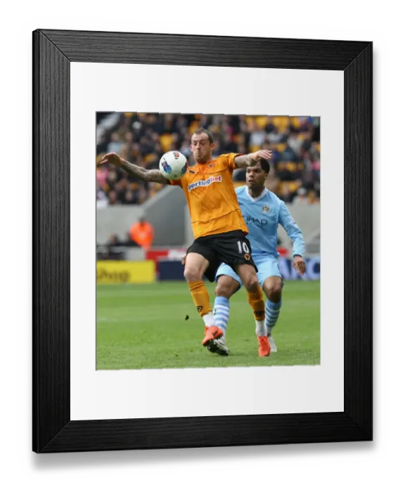 Framed Print : Wolverhampton Wanderers Fletcher Stands Firm Against Manchester City: A Battle for the Ball Framed Print : Wolverhampton Wanderers Fletcher Stands Firm Against Manchester City: A Battle for the Ball