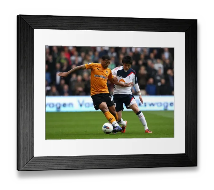 Framed Print : Ferocious Battle for Ball Possession: Wolverhampton Wanderers vs. Bolton Wanderers in the Premier League Framed Print : Ferocious Battle for Ball Possession: Wolverhampton Wanderers vs. Bolton Wanderers in the Premier League