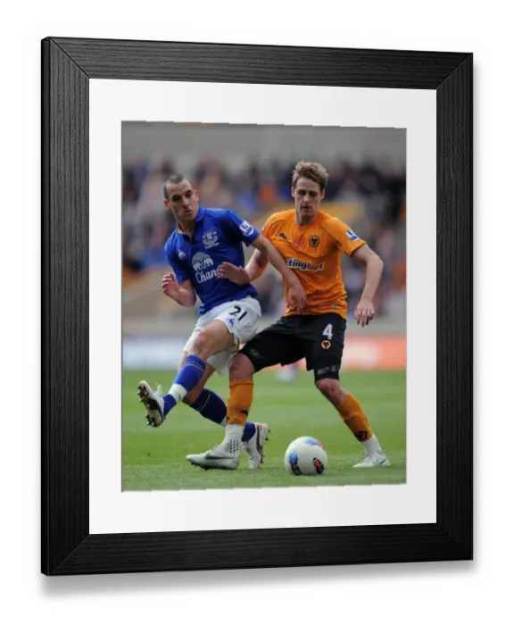 Framed Print : Wolverhampton Wanderers vs. Everton: A Premier League Battle - Edwards vs. Osman