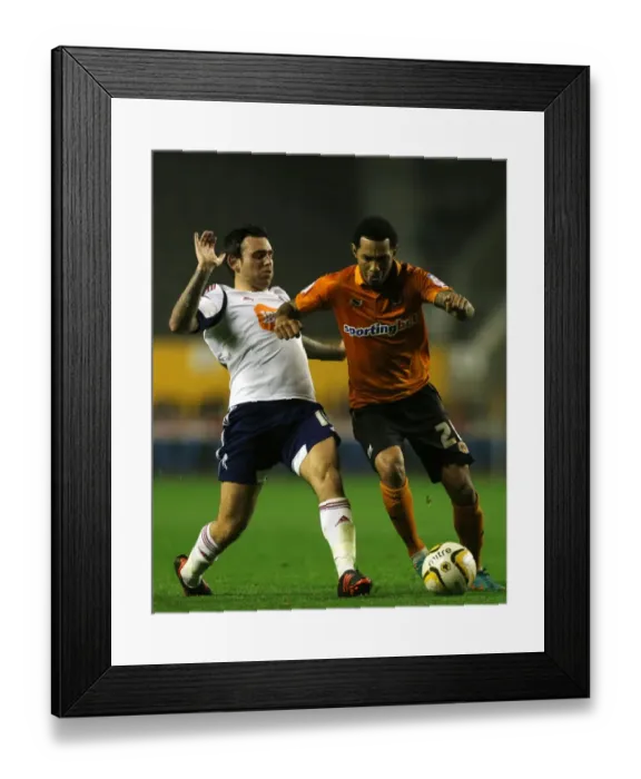 Framed Print : Wolverhampton Wanderers: Jermaine Pennant Outmaneuvers Mark Davies in Championship Showdown at Molineux