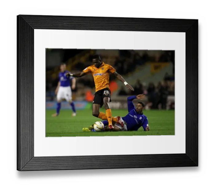 Framed Print : Intense Championship Showdown: Tongo Doumbia vs. Hayden Mullins at Molineux