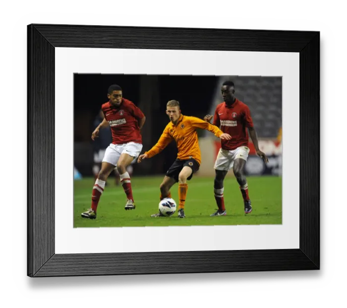 Framed Print : Tense Showdown: Holmes-Dennis vs. Sho-Silva in FA Youth Cup Clash at Molineux (Wolverhampton Wanderers U18 vs Charlton Athletic U18)