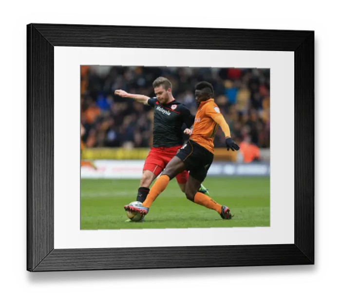 Framed Print : Wolverhampton Wanderers vs. Cardiff City: A Championship Showdown - Midfield Battle between Sako and Gunnarsson Framed Print : Wolverhampton Wanderers vs. Cardiff City: A Championship Showdown - Midfield Battle between Sako and Gunnarsson