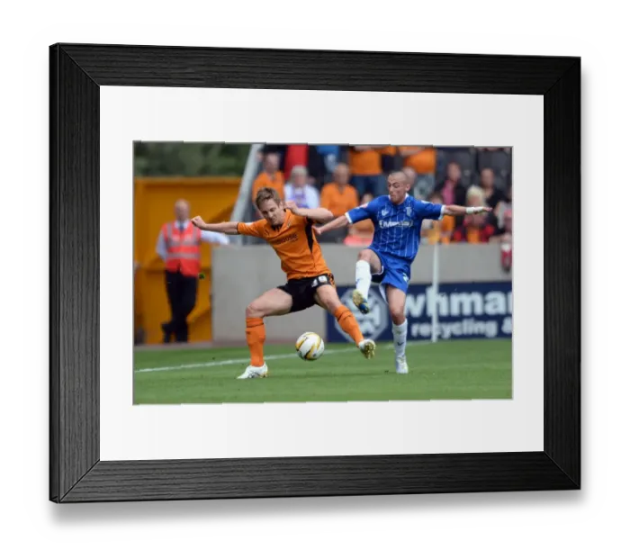 Framed Print : Intense Battle for Possession: Wolverhampton Wanderers vs. Gillingham Framed Print : Intense Battle for Possession: Wolverhampton Wanderers vs. Gillingham