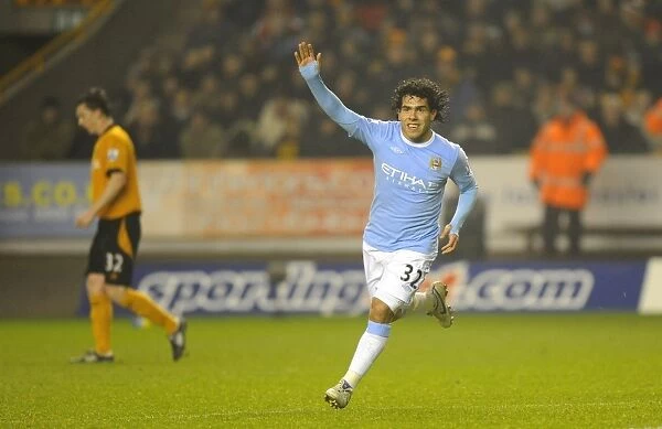 Carlos Tevez's Goal Celebration: Manchester City Takes the Lead over Wolverhampton Wanderers in Premier League Soccer Match