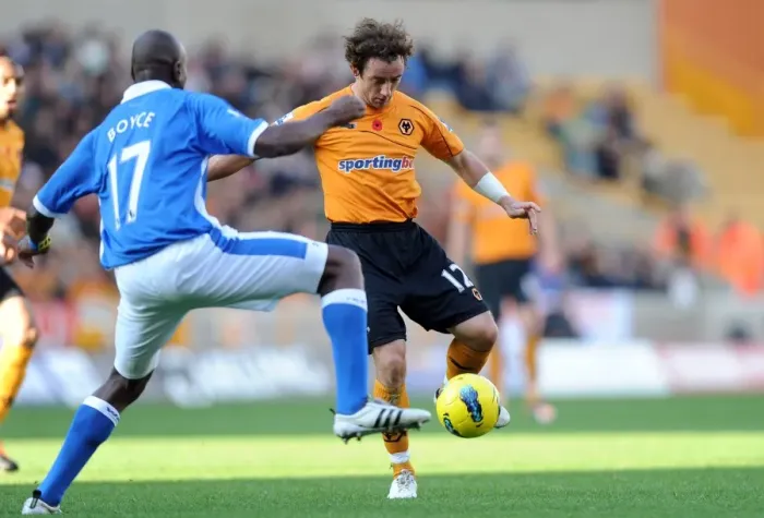 Framed Print : Clash between Hunt and Boyce: Wolverhampton Wanderers vs. Wigan Athletic in Premier League Soccer Framed Print : Clash between Hunt and Boyce: Wolverhampton Wanderers vs. Wigan Athletic in Premier League Soccer