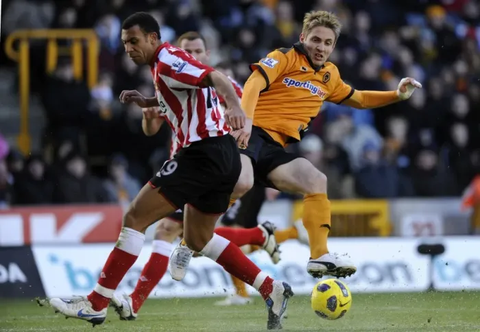 Framed Print : Clash between Kevin Doyle and Anton Ferdinand: A Intense Moment in the Wolverhampton Wanderers vs Sunderland Barclays Premier League Match